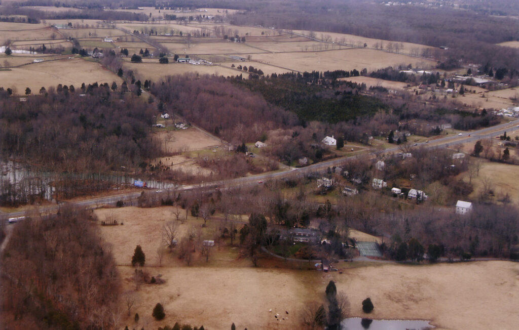 Aerial view of Buckland from the northeast. Cerro Gordo is in the foreground, town in the center right. Buckland Mill Road (historic Mill Street) extends from the mill at lower right to Buckland Hall at top left. Rt-15/29 bisects Buckland on the original Fauquier and Alexandria Turnpike right-of-way.